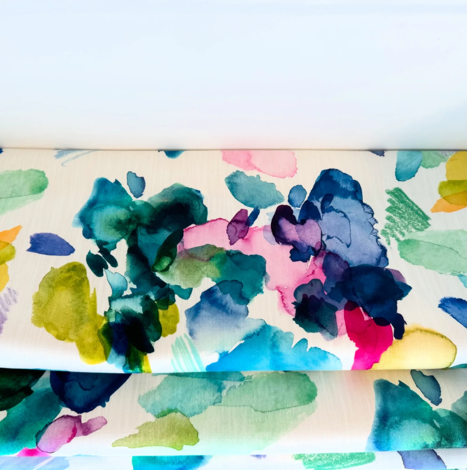 Roman blind made up in Bluebell Gray Palette, a watercolour floral in teal, pink and ochre, in the study at Stevenstone, Devon