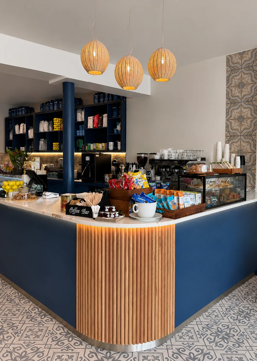 The coffee bar with a fluted timber front, navy cabinetry and three rattan pendants, Amalfi Bar & Cafe, Bideford, Devon