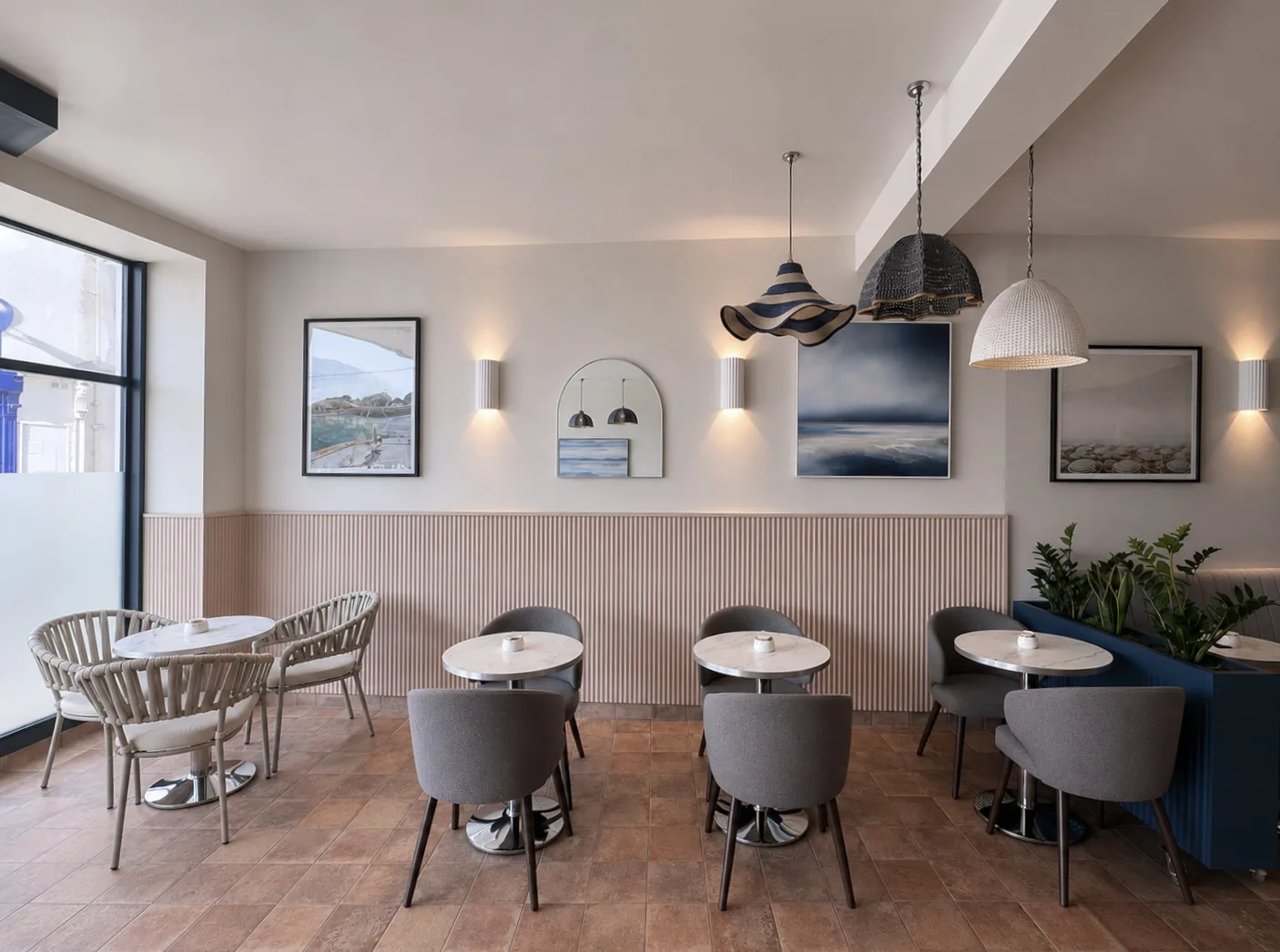 The cafe at Amalfi Bar & Cafe in Bideford, Devon, with woven pendants, fluted oak panelling and seascape paintings