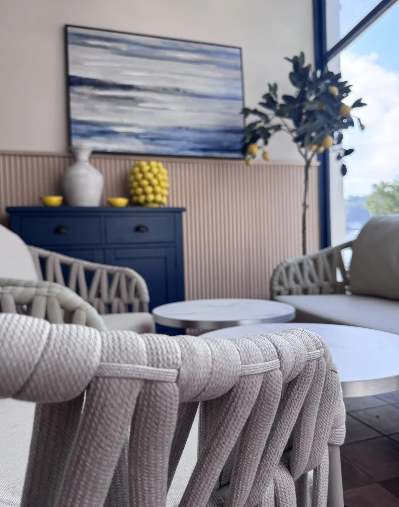 Rope backed armchairs and a sofa in the lounging area, looking out to the river, Amalfi Bar & Cafe, Bideford, Devon