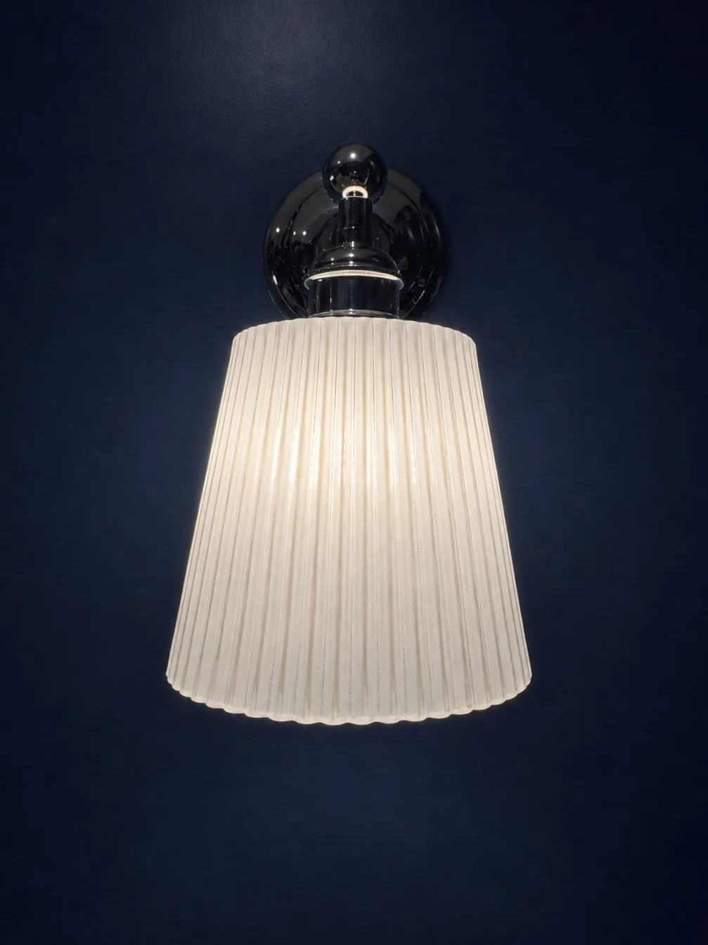 A second chrome and ribbed glass wall light above the patterned tiling in the rest rooms, Amalfi Bar & Cafe, Bideford, Devon