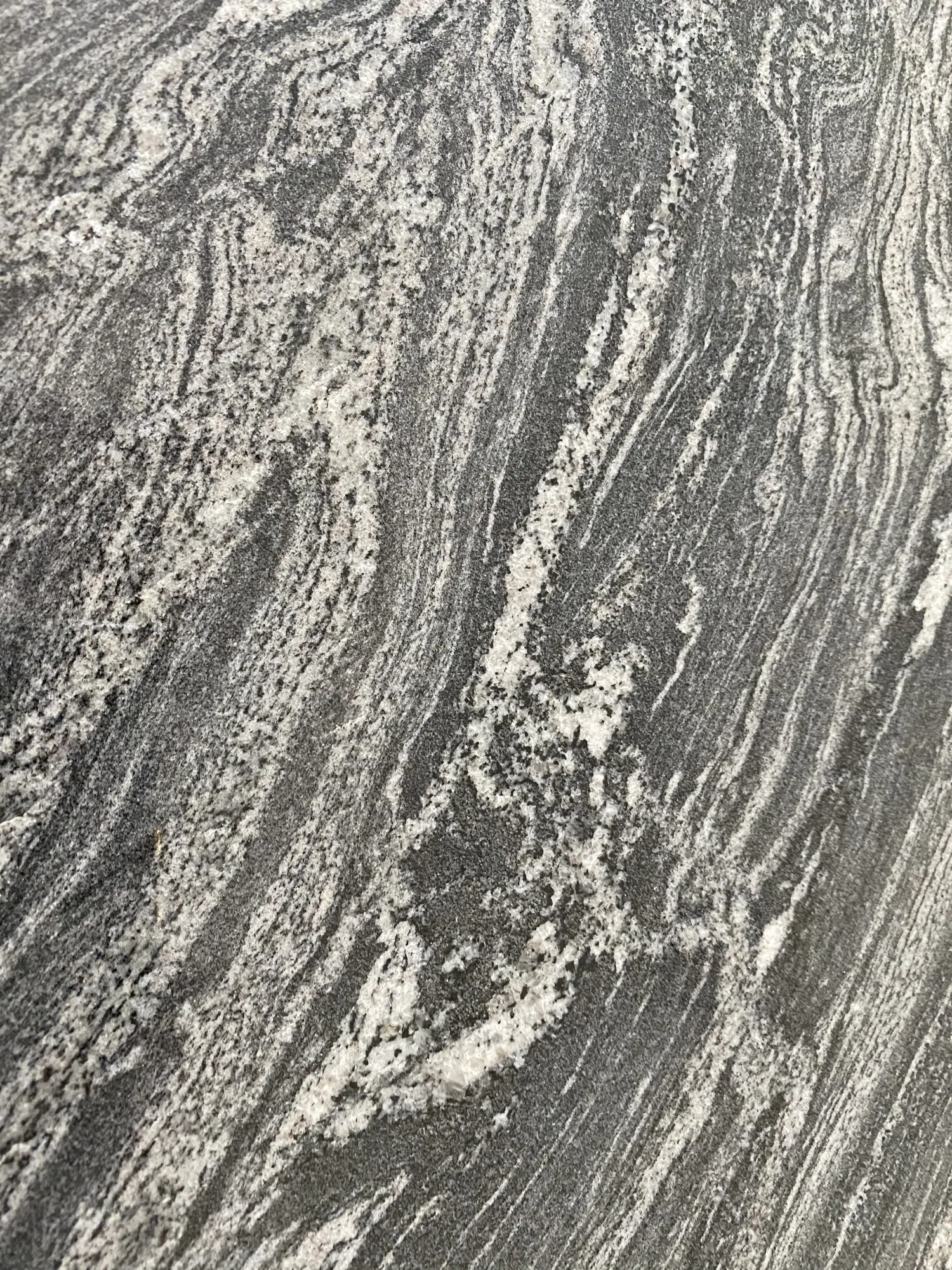 Black granite kitchen worktop with grey and white veining, in a contemporary new build in Northam, Devon