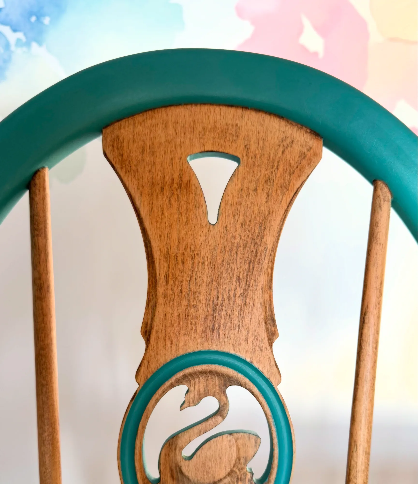 Back of an upcycled Ercol dining chair in oak with teal paint, Stevenstone, Devon