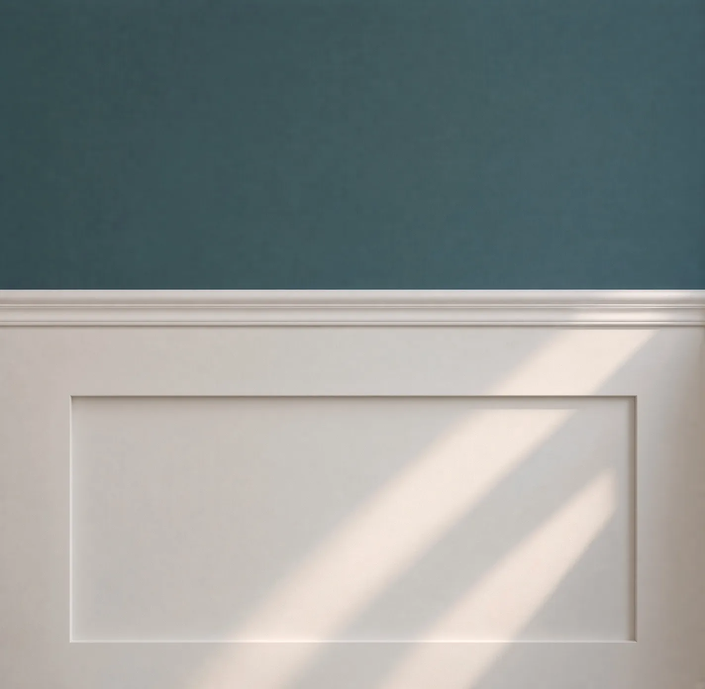 Deep teal wall above white painted panelling, with sunlight raking across it, at Ethos HQ in London