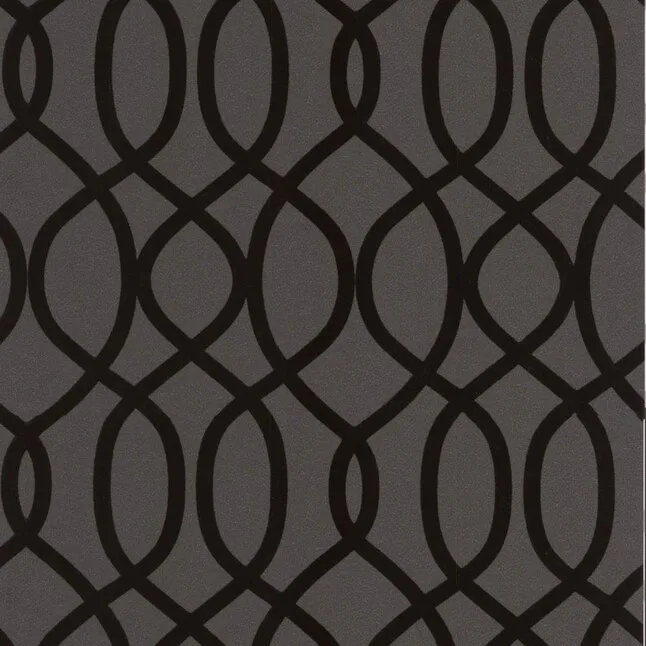 Black flock wallpaper in a raised geometric lattice, used on the bar front, at Swell Bar & Kitchen in Truro, Cornwall