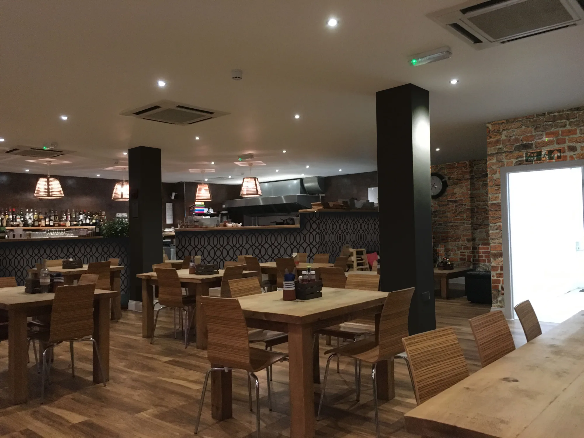 CGI render of the proposed restaurant interior, showing the layout and the mural wall, at Swell Bar & Kitchen in Truro, Cornwall